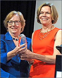 Nursing's Linda Aiken presents Mary Naylor, PhD, RN, FAAN, with the AcademyHealth 2016 Distinguished Investigator Award on stage at the Boston conference. Both are Professors in the School of Nursing and LDI Senior Fellows.
