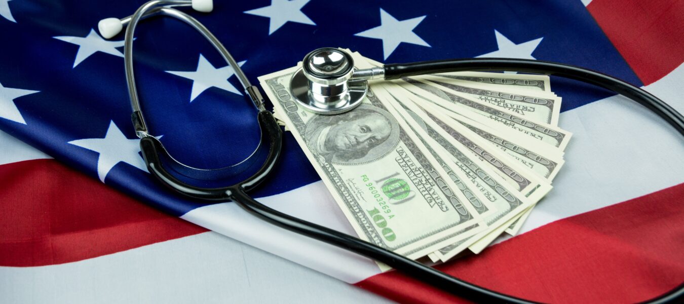 American flag with stethoscope and US currency
