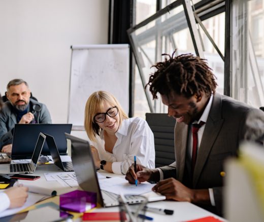 People in a meeting collaborating.