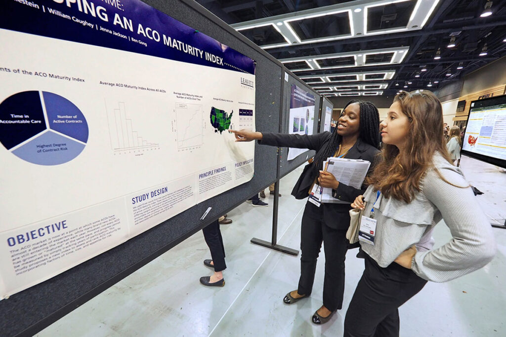 LDI SUMR Scholars Christine Olagun-Samuel and Zara Wermers discuss a poster project that tracks the evolution of Accountable Care Organizations