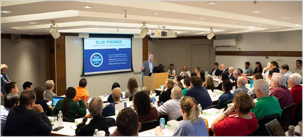 Patrick Conway, CEO of Blue Cross and Blue Shield of North Carolina, speaking in the auditorium of Penn's Leonard Davis Institute.