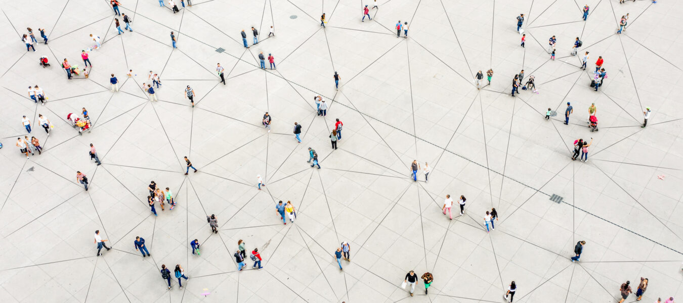 Aerial view of people walking connected by lines.