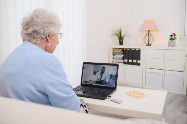 Elderly woman looking at laptop during telemedicine appointment.