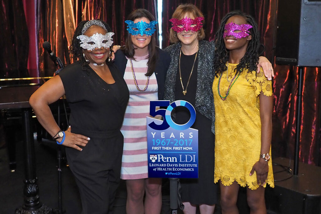 In Mardi Gras masks are Kim Hall Jackson, Emily Shields, Joanne Levy, and Safa Brown.