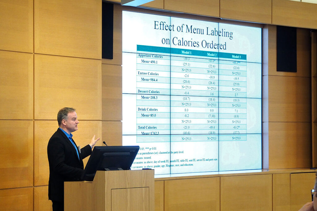 Cornell's John Cawley speaking at a conference on the impact of restaurant calorie labels on food choice.