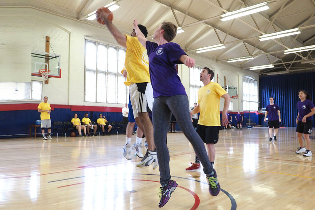 In a flying lunge at the basketball controlled by Amol Navathe is Sarah Dykstra. Looking on are Assistant Professor of Health Care Management Matthew Grennan, Vicky Chen and Henry Bergquist.