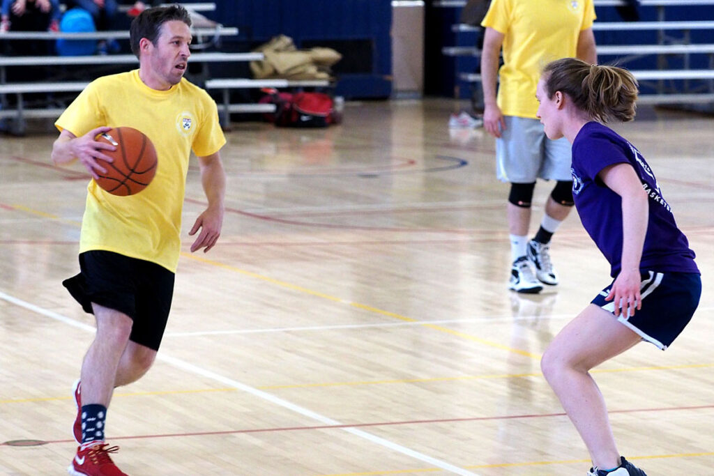 Going head to head on the basketball court are Matthew Grennan and Amy Bond. 