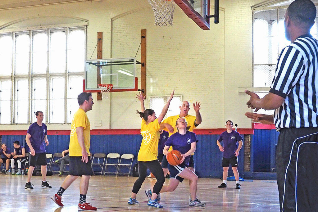 Struggling mightily under the basketball net is Amy Bond surrounded by Henry Bergquist, Matthew Grennan, Amanda Starc, Robert Town, Evan Saltzman and ref Rodney Banks