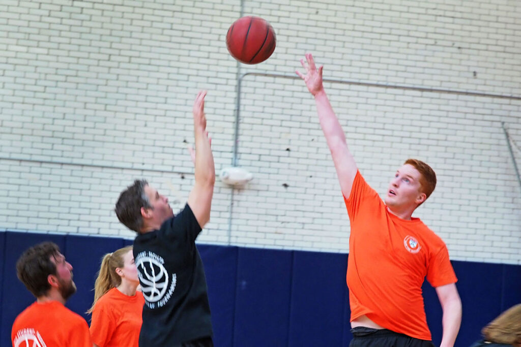Leaping for the rebound (above, left) are Wharton assistant professor Matthew Grennan and LDI Postdoctoral Fellow Benjamin Ukert