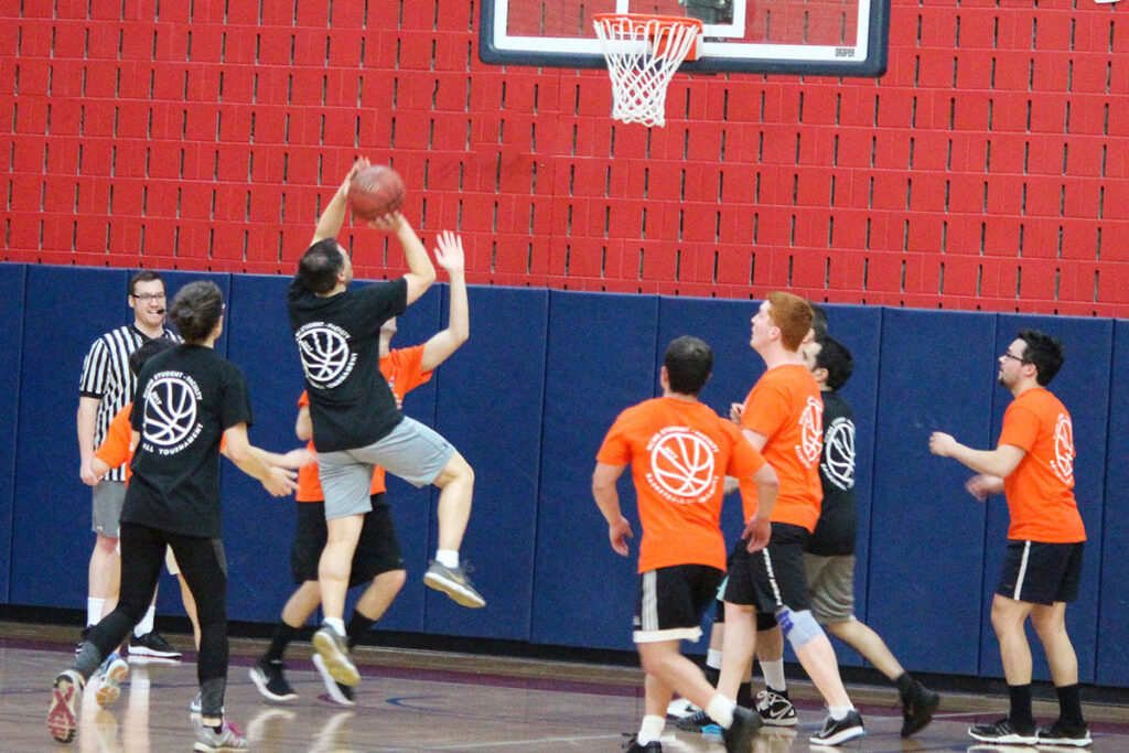Daniel Polsky scores a basket on the basketball court