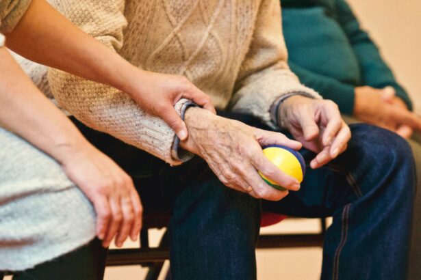 An older person holding a small ball