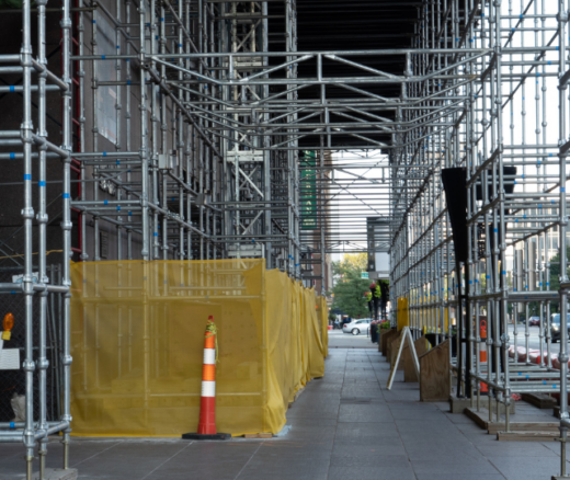 sidewalk covered by construction scaffolding