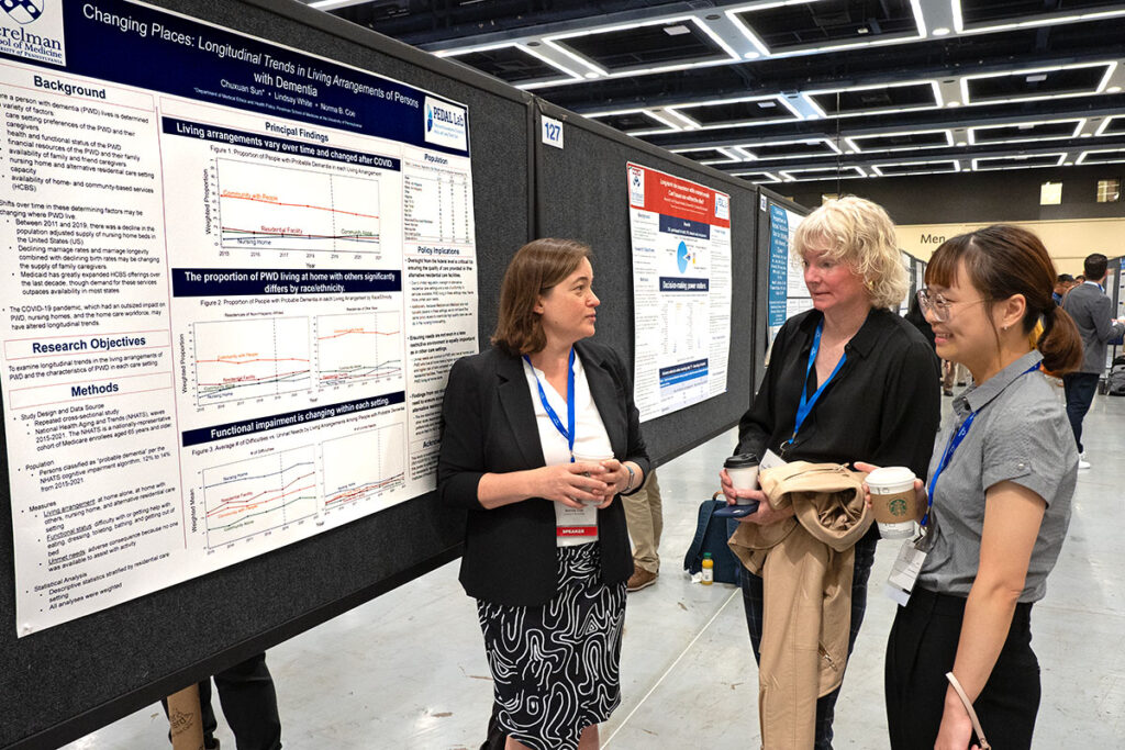 Norma Coe, Courtney Van Houtven, and Chuxuan Sun at a scientific convention