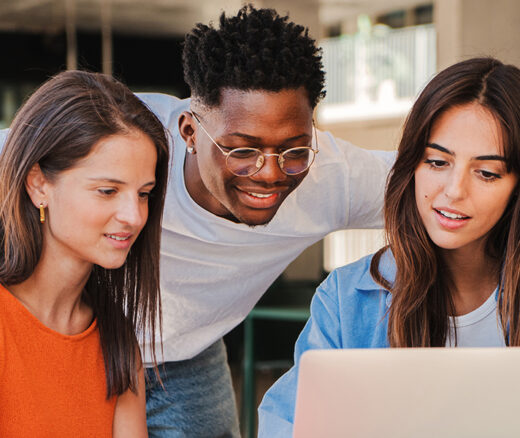 Students looking at a computer